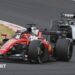Ferrari's Charles Leclerc goes around a right-hand corner during the Japanese Grand Prix with Mercedes' George Russell right behind him