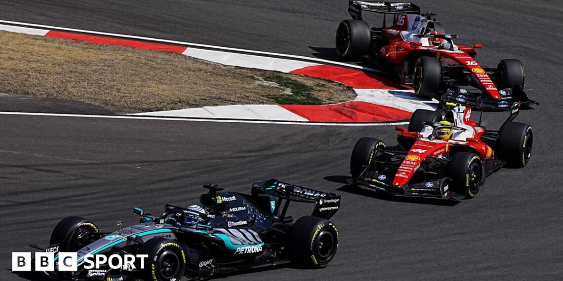 Mercedes' George Russell comes out of a hairpin ahead of Ferrari's Lewis Hamilton with Charles Leclerc immediately behind during the Chinese Grand Prix sprint race