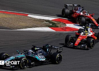 Mercedes' George Russell comes out of a hairpin ahead of Ferrari's Lewis Hamilton with Charles Leclerc immediately behind during the Chinese Grand Prix sprint race