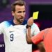 Harry Kane argues with Brazilian referee Wilton Sampaio as he shows a yellow card