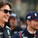 George Russell and Max Verstappen smiling prior to the F1 Grand Prix of Abu Dhabi in December 2025
