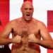 Tyson Fury tenses for the cameras at the weigh-in