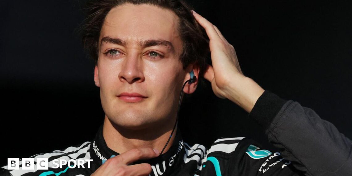 George Russell runs his right hand through his hair as he prepares for the start of the 2026 Japanese Grand Prix