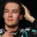 George Russell runs his right hand through his hair as he prepares for the start of the 2026 Japanese Grand Prix