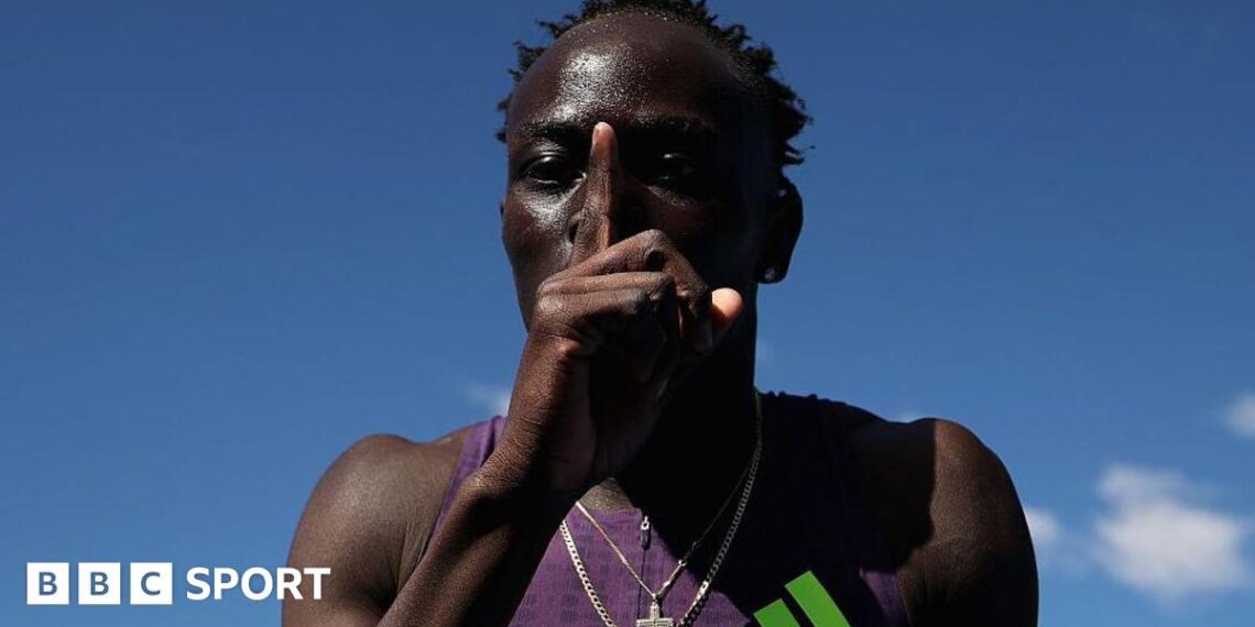 Australian sprinter Gout Gout puts his finger to his lips and makes a '1' sign after his win