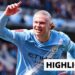 Erling Haaland of Manchester City smiles and celebrates his goal with one arm in the air