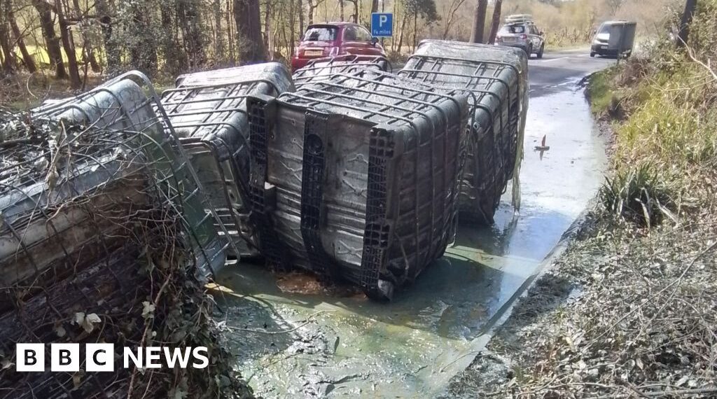 Huge containers of liquid waste dumped by roadside