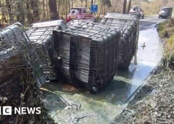 Huge containers of liquid waste dumped by roadside