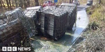 Huge containers of liquid waste dumped by roadside