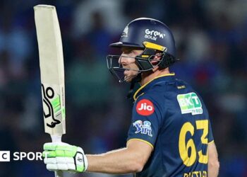 Jos Buttler salutes the crowd after reaching fifty for Gujarat Titans