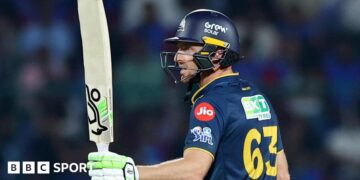 Jos Buttler salutes the crowd after reaching fifty for Gujarat Titans