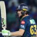 Jos Buttler salutes the crowd after reaching fifty for Gujarat Titans