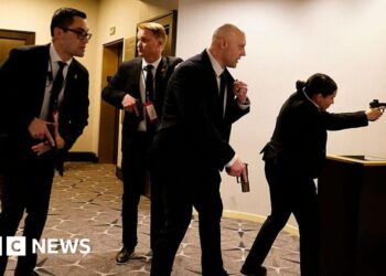 In pictures: Chaos as gunfire heard in Washington DC ballroom