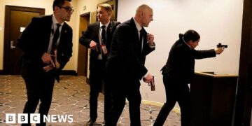 In pictures: Chaos as gunfire heard in Washington DC ballroom
