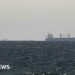 Iran says Strait of Hormuz is 'open' but tracking shows few ships moving