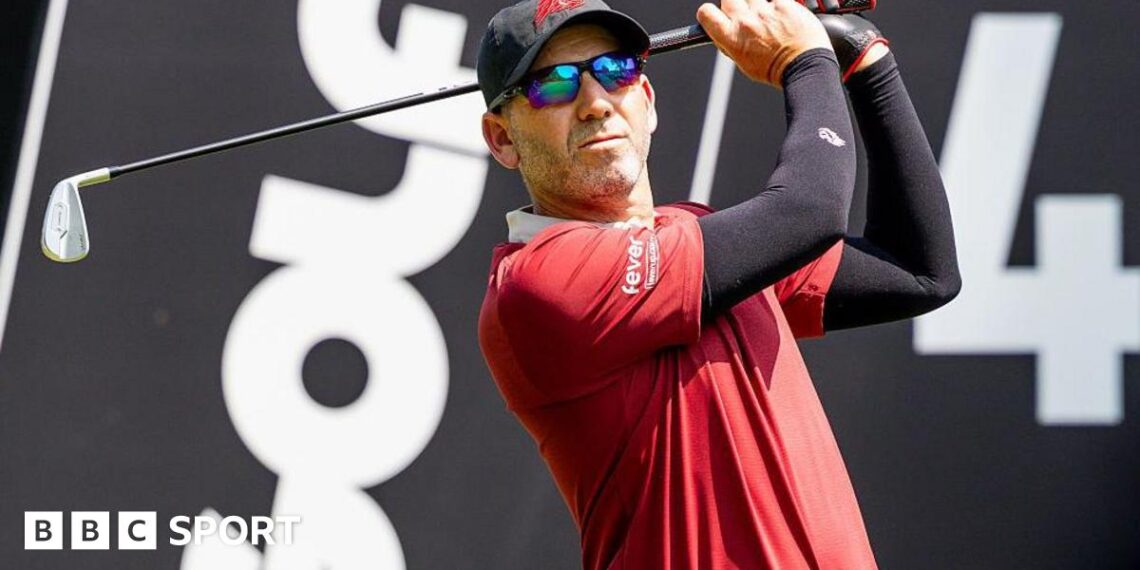 Sergio Garica tees off during a LIV Golf tournament with the branding in the background