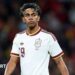 Lamine Yamal wearing a white Spain shirt