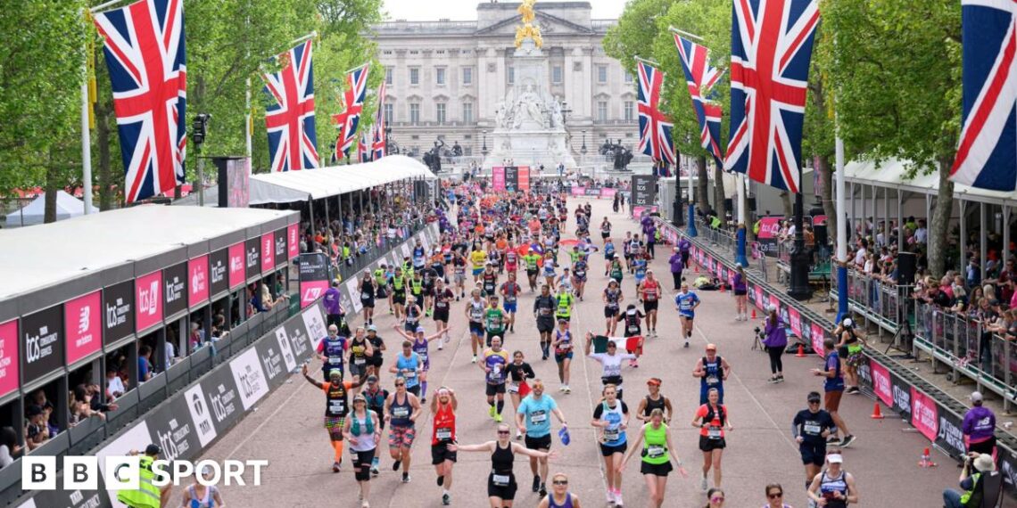 Runners make their way down The Mall to the London Marathon finish line