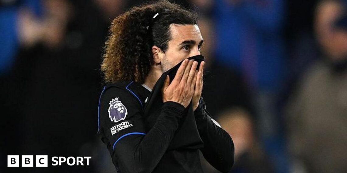 Marc Cucurella pulls his shirt up over his mouth after defeat at Brighton
