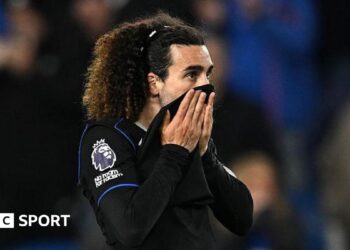 Marc Cucurella pulls his shirt up over his mouth after defeat at Brighton