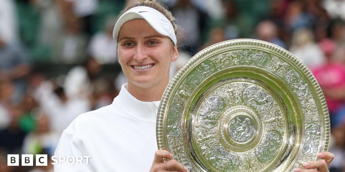 Marketa Vondrousova holding the Wimbledon trophy after winning the women's title in 2023