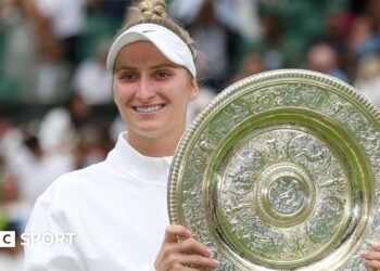 Marketa Vondrousova holding the Wimbledon trophy after winning the women's title in 2023