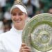Marketa Vondrousova holding the Wimbledon trophy after winning the women's title in 2023