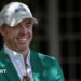Rory McIlroy smiles as he talks to Augusta officials on his return to the Masters
