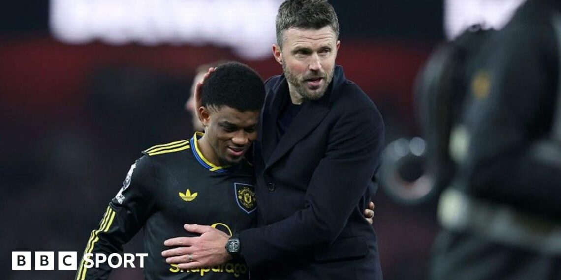 Manchester United winger Amad Diallo (left) with head coach Michael Carrick