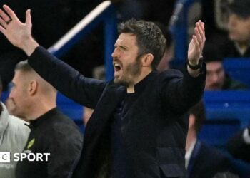 Man Utd manager Michael Carrick holds his arms out