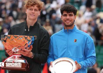 Jannik Sinner holds the Monte Carlo Master trophy alongside Carlos Alcaraz