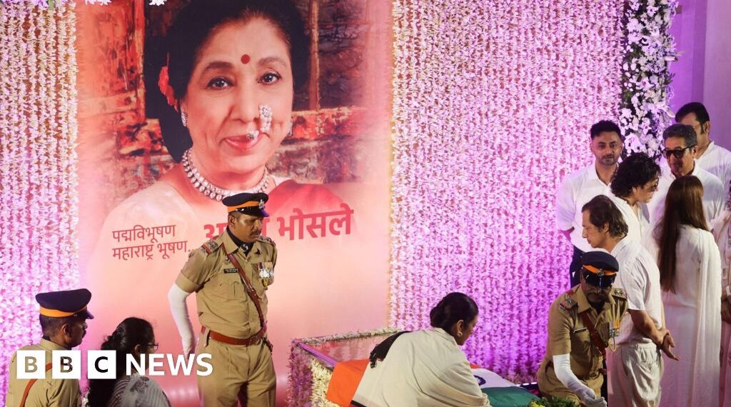 Mourners sing Asha Bhosle hit as iconic Indian singer cremated
