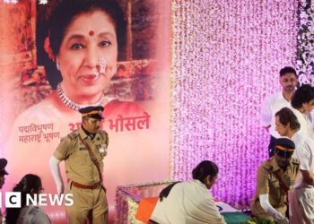 Mourners sing Asha Bhosle hit as iconic Indian singer cremated