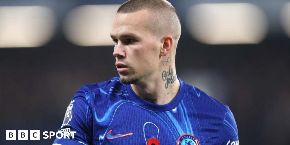 Mykhailo Mudryk looking to his right while playing in a Chelsea kit