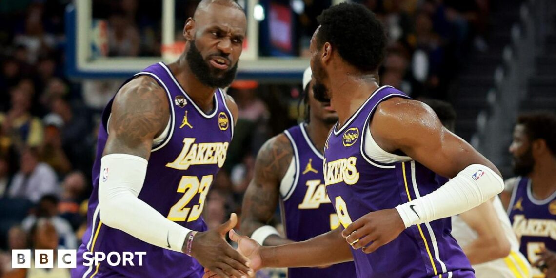 LeBron James and son Bronny on court for LA Lakers against Golden State Warriors