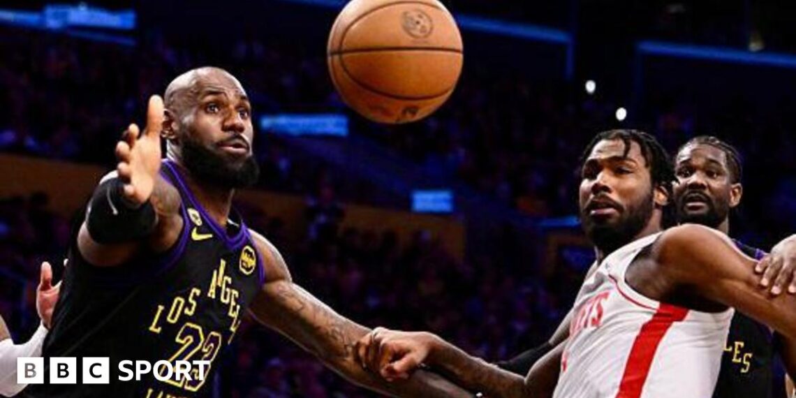 LeBron James reaching for the ball while playing for the Los Angeles Lakers against the Houston Rockets in game two of their 2026 NBA play-off series