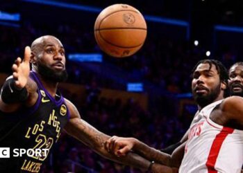 LeBron James reaching for the ball while playing for the Los Angeles Lakers against the Houston Rockets in game two of their 2026 NBA play-off series