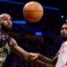 LeBron James reaching for the ball while playing for the Los Angeles Lakers against the Houston Rockets in game two of their 2026 NBA play-off series