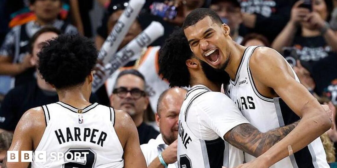 Julian Champagnie hugs Victor Wembanyama during the San Antonio Spurs' win over the Portland Trail Blazers in game four of their 2026 NBA play-off series