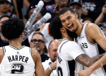 Julian Champagnie hugs Victor Wembanyama during the San Antonio Spurs' win over the Portland Trail Blazers in game four of their 2026 NBA play-off series