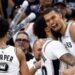 Julian Champagnie hugs Victor Wembanyama during the San Antonio Spurs' win over the Portland Trail Blazers in game four of their 2026 NBA play-off series
