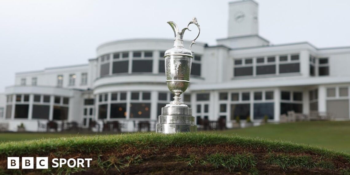 The Claret Jug photographed on top of a bunker in front of the Royal Birkdale clubhouse