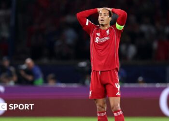 Liverpool's players react after losing to Paris St-Germain in the Champions League