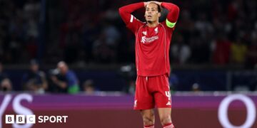 Liverpool's players react after losing to Paris St-Germain in the Champions League