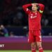 Liverpool's players react after losing to Paris St-Germain in the Champions League