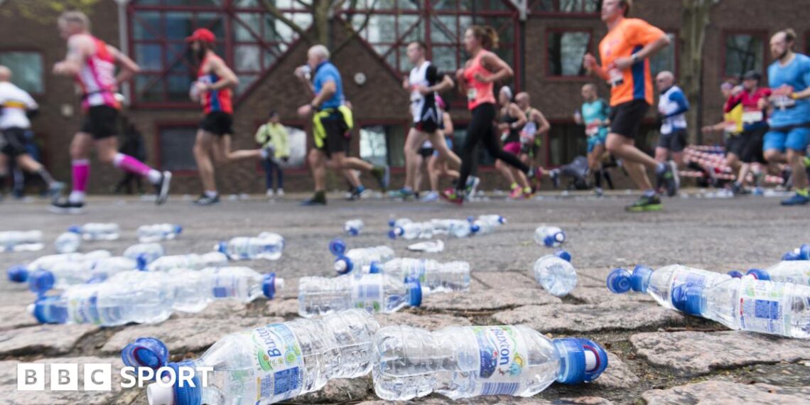 Discarded plastic bottles on the side of a marathon course