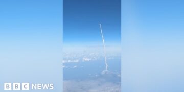 Passengers watch Artemis II blast off from commercial plane