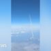 Passengers watch Artemis II blast off from commercial plane