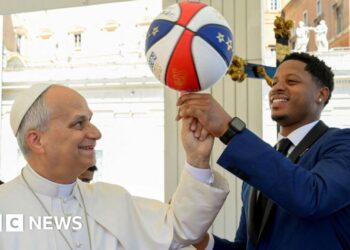 Pope Leo XIV spins basketball on his finger, with help from Harlem Globetrotters