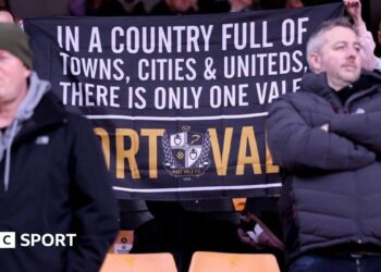 Port Vale fans with a banner that reads: "In a country full of towns, cities & uniteds, there is only one Vale - Port Vale"